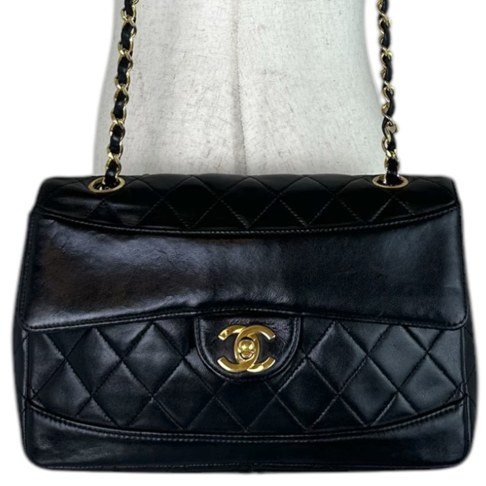 CHANEL Black Quilted Shoulder Bag with Gold Accents
